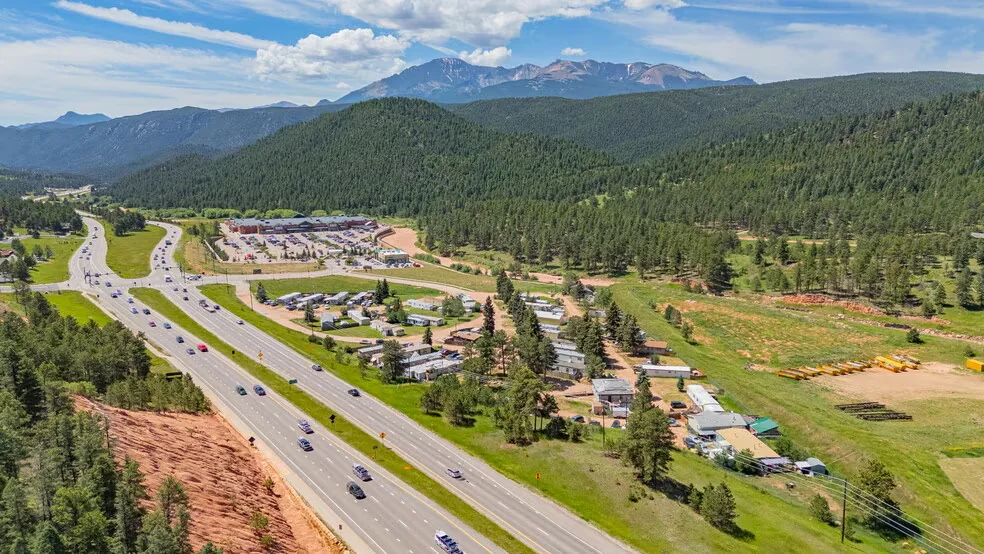 Elevated view along US Highway 24 through woodland park real estate Colorado with Pikes Peak and pine forest
