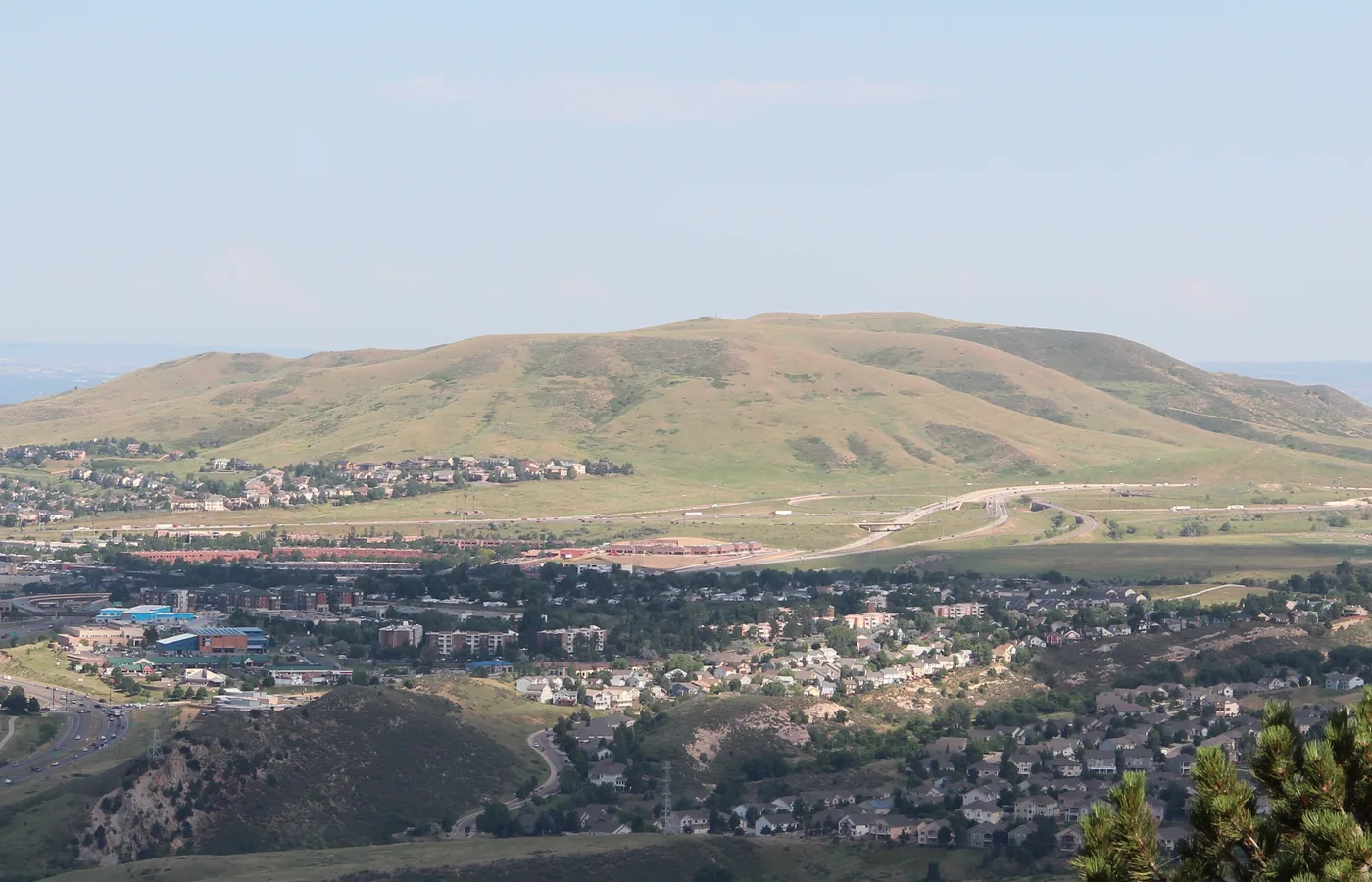Elevated view of Green Mountain rising above Lakewood, Colorado with neighborhoods and highways below