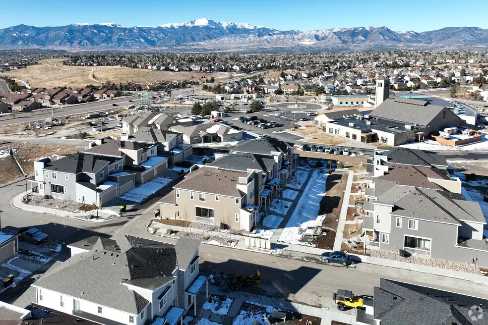 Elevated view of the Briargate area in Colorado Springs with homes and Pikes Peak on a light winter day